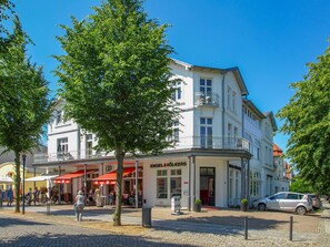 A multi-story building with a ground-floor shop and upper residential or office spaces.