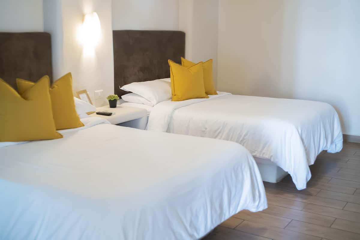 double room, 2 double beds | individually furnished, laptop workspace, iron/ironing board, bed sheets