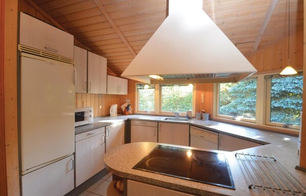 Fridge, stovetop, dishwasher, coffee/tea maker