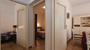 A hotel room with a bed, a nightstand, a dresser, and a chair. - 2 bedroom pet friendly home in Medulin (Medulin)