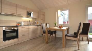 Fridge, stovetop, dishwasher, coffee/tea maker