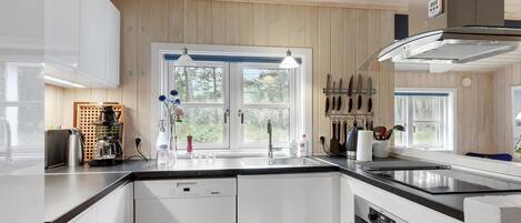 Fridge, stovetop, dishwasher, coffee/tea maker