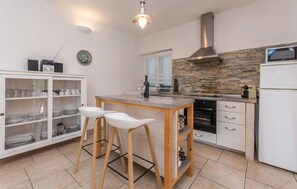 Fridge, stovetop, dishwasher, coffee/tea maker
