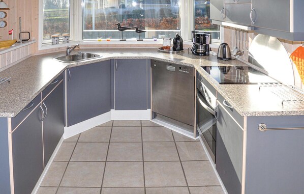 Fridge, stovetop, dishwasher, coffee/tea maker