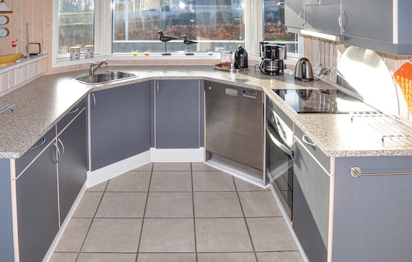 Fridge, stovetop, dishwasher, coffee/tea maker