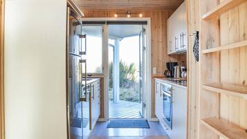 Fridge, stovetop, dishwasher, coffee/tea maker