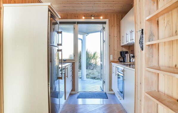 Fridge, stovetop, dishwasher, coffee/tea maker