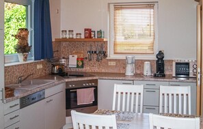 Fridge, stovetop, dishwasher, coffee/tea maker