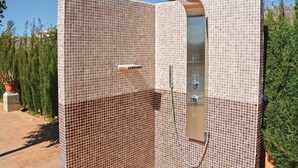 A tiled shower enclosure with a control panel and a handheld showerhead. - Cozy home in Lluchmajor (Lluchmajor)
