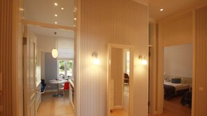 A modern interior with a dining area, a bedroom, and a bathroom. - *****Düne25 ++with SEA VIEW and only 10m from the beach++ - Apartment with 2 bedrooms (Zinnowitz)