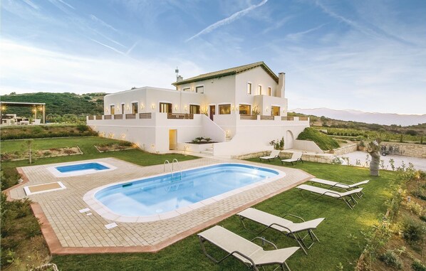 A modern two-story house with a swimming pool and outdoor seating. - Beautiful home in Houdetsi,Heraklio (Houdetsi,Heraklio)