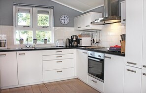 Fridge, stovetop, dishwasher, coffee/tea maker