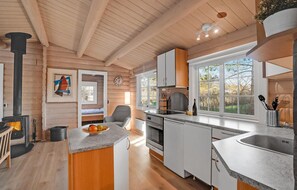 Fridge, stovetop, dishwasher, coffee/tea maker