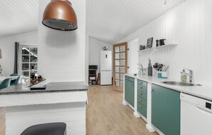 Fridge, stovetop, dishwasher, coffee/tea maker