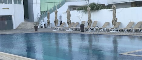 Indoor pool, outdoor pool, pool umbrellas, pool loungers