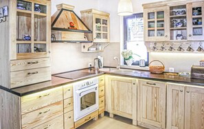 Fridge, stovetop, dishwasher, coffee/tea maker
