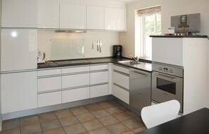 Fridge, stovetop, dishwasher, coffee/tea maker