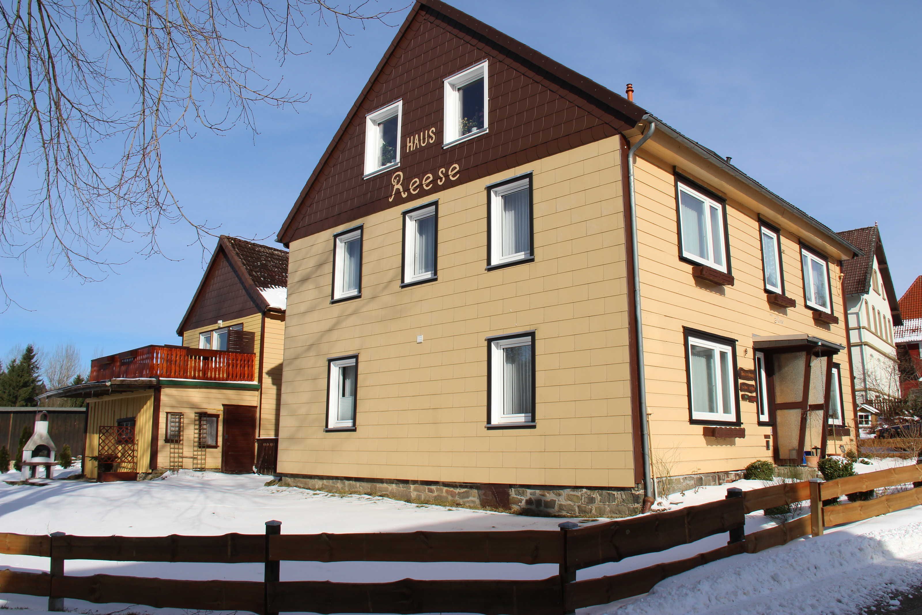 A two-story building with a sign reading 'HAUS Reese' on the facade.