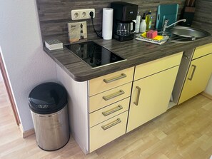 Fridge, coffee/tea maker, electric kettle, toaster