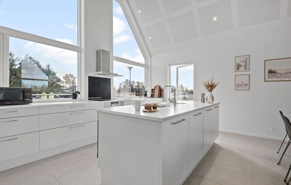 Fridge, stovetop, dishwasher, coffee/tea maker