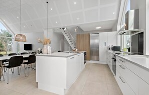 Fridge, stovetop, dishwasher, coffee/tea maker