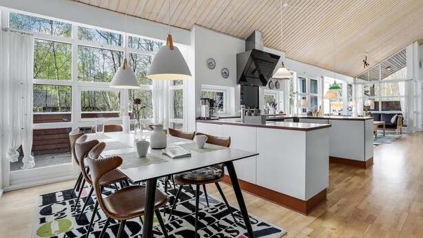 A modern kitchen with a central island, large windows, and pendant lighting. - Gorgeous home in Hasle with WiFi (Hasle)