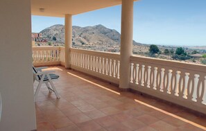 A balcony with a tiled floor, white balustrade, and a view of a mountainous landscape. - 3 bedroom amazing home in Monnegre (Monnegre)