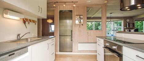 Fridge, stovetop, dishwasher, coffee/tea maker