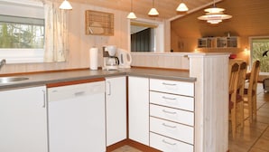 A kitchen with white cabinets, a Siemens dishwasher, a coffee maker, and pendant lights. - 3 bedroom cozy home in Oksbøl (Oksbøl)