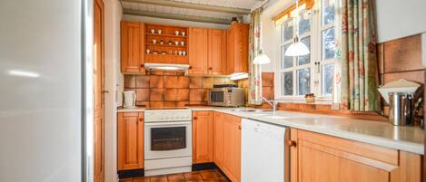 Fridge, stovetop, dishwasher, coffee/tea maker