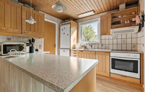 Fridge, stovetop, dishwasher, coffee/tea maker