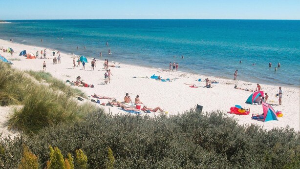 A beach with people sunbathing and swimming. - Amazing home in Aakirkeby with kitchen (Aakirkeby)