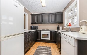 Fridge, stovetop, dishwasher, coffee/tea maker