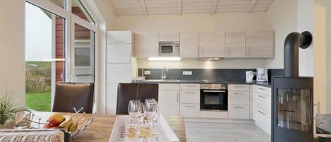 Fridge, stovetop, dishwasher, coffee/tea maker