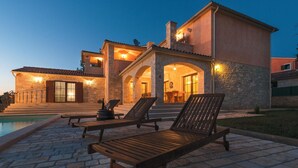 A stone villa with a pool, outdoor seating, and warm lighting. - Beautiful home in Vodnjan (Vodnjan)