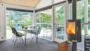 A modern kitchen with a large island, stainless steel appliances, and a view of the outdoors. - Amazing home in Ebeltoft with sauna (Ebeltoft)