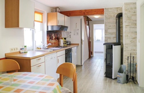 Fridge, stovetop, dishwasher, coffee/tea maker