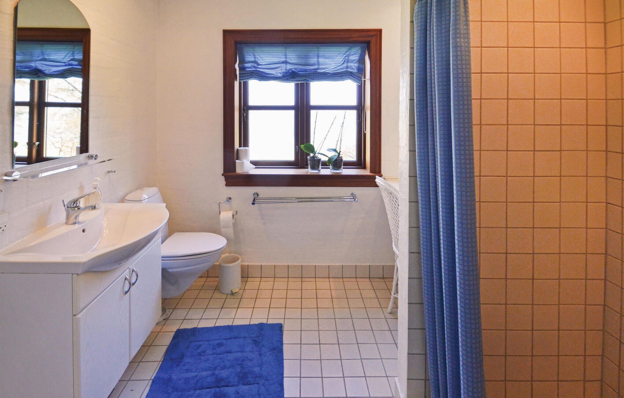 A bathroom with a sink, toilet, and bathtub.