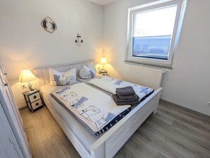 2 quartos, berço de viagem, Wi-Fi, roupa de cama