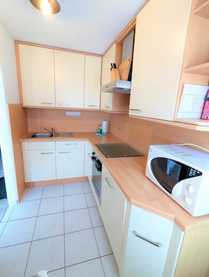 Fridge, microwave, oven, high chair