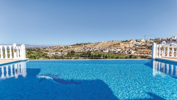 A clear blue pool with a view of a hillside town. - Amazing home in Ciudad Quesada-Rojales (Ciudad Quesada-Rojales)