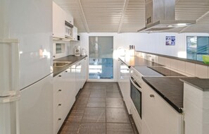 Fridge, stovetop, dishwasher, coffee/tea maker