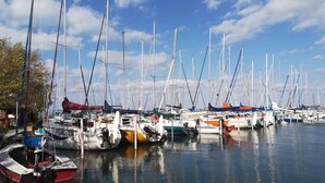 A marina with numerous sailboats docked in calm waters. - Holiday home with barbecue and garden furniture (Siófok)