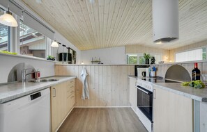 Fridge, stovetop, dishwasher, coffee/tea maker