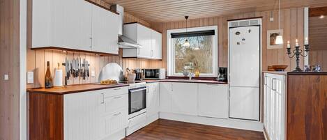 Fridge, stovetop, dishwasher, coffee/tea maker