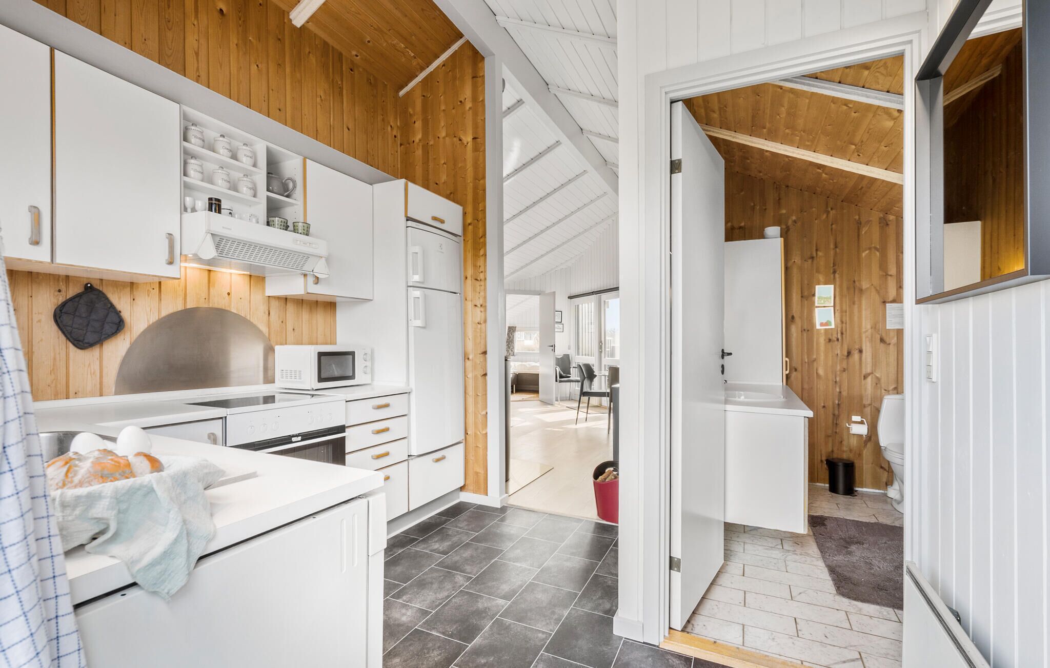 Fridge, stovetop, dishwasher, coffee/tea maker