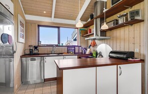 Fridge, stovetop, dishwasher, coffee/tea maker