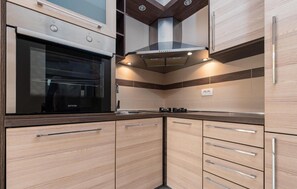 Fridge, stovetop, dishwasher, coffee/tea maker