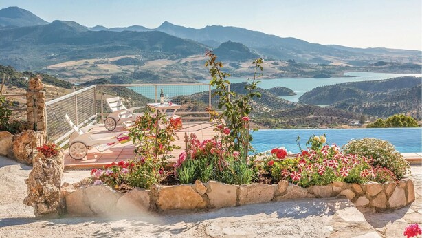 A poolside area with a view of mountains and a lake. - Awesome home in Cádiz (Cádiz)