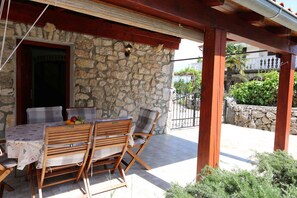 Outdoor dining - Holiday home in Mediterranean stone house style (Šilo)
